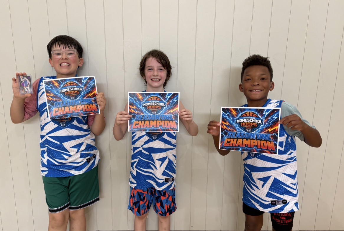 Elementary players holding Season One Champion certificates